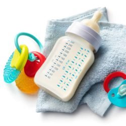 Baby Bottle, Teething Ring, Napkin and Pacifier Isolated on White Background. More baby goods photos can be found in my portfolio! Please have a look.
